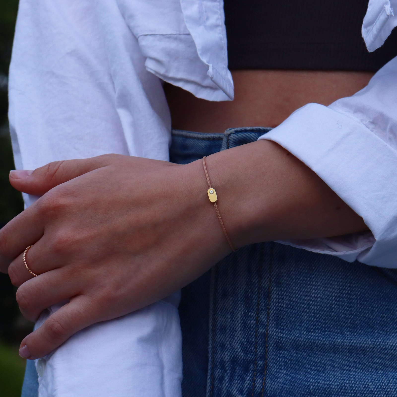 “Plate” Diamond String Bracelet on wrist