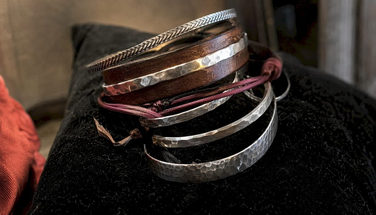 Close-up layered bracelets with varied textures